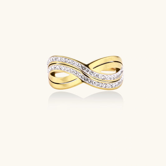 Gold-plated ring with interweaving wave bands and two rows of clear rhinestones creating an infinity pattern