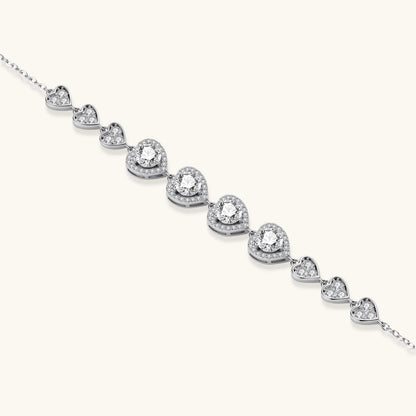 Complete jewelry set with heart-shaped sterling silver pieces featuring brilliant moissanite stones on white background.