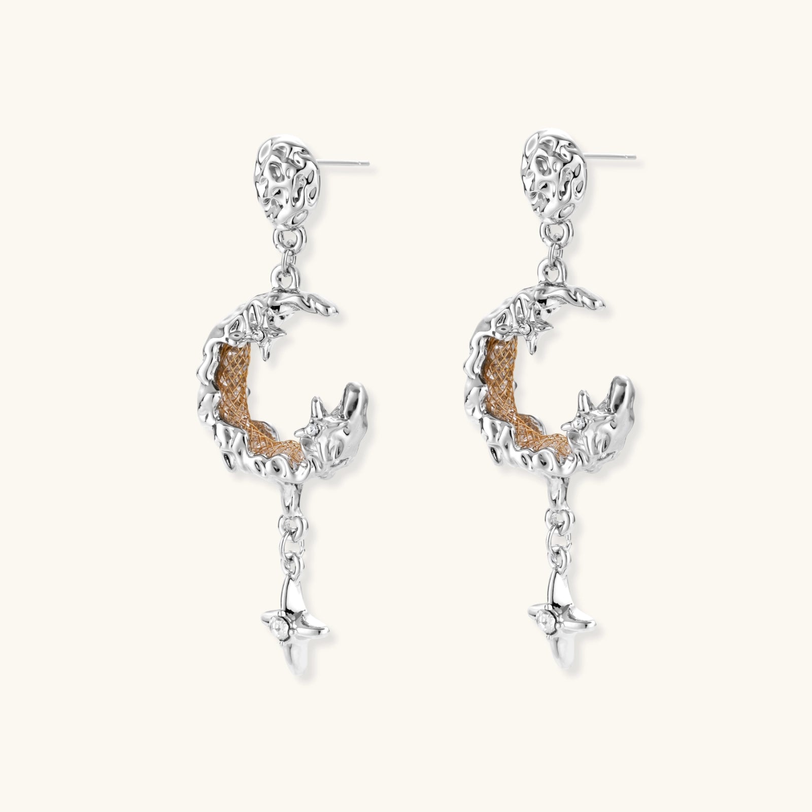 Detailed eco-brass dangle earrings featuring crescent moons with gold rope details and dangling star charms on white background.