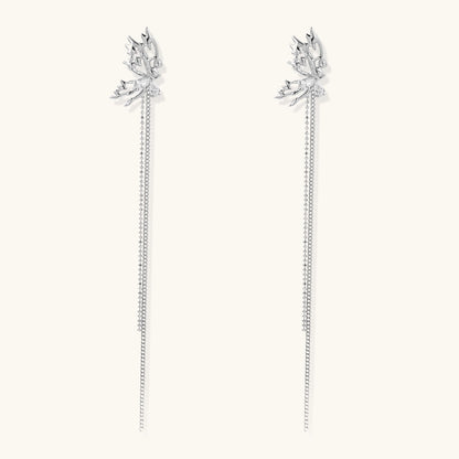 Silver-toned threader earrings featuring detailed fairy figure with wings and dual delicate chain strands, zirconia accents