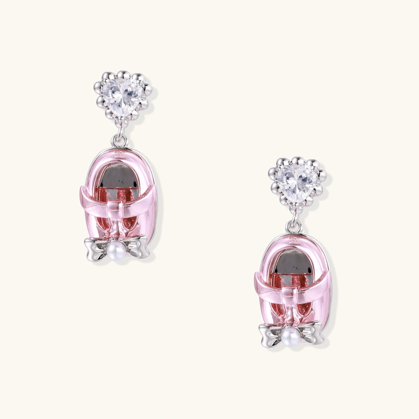 Pink translucent cage earrings with heart-shaped zirconia tops and pearl accents on white gold plated posts.