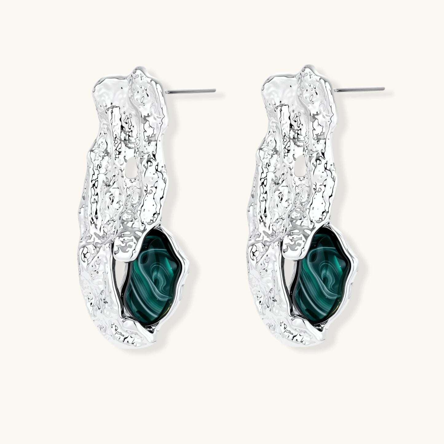 Organic-shaped stud earrings with hammered silver finish and green malachite-pattern resin stones on white background.